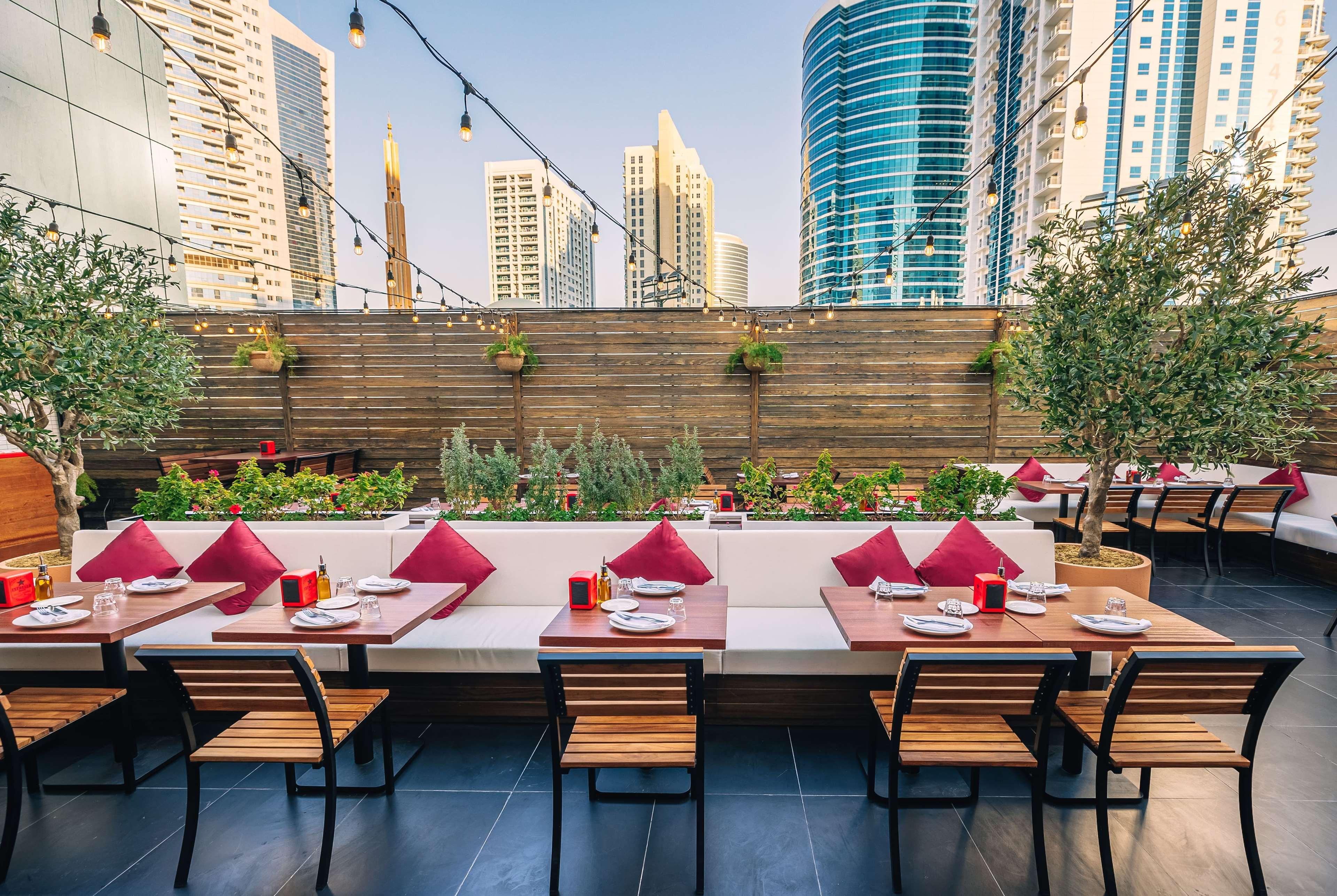 Tryp By Wyndham Dubai Hotel Exterior photo The restaurant's rooftop terrace