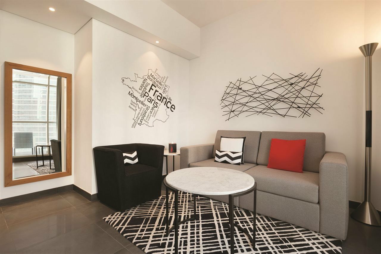 Tryp By Wyndham Dubai Hotel Exterior photo The word "Paris" in the wall of a room at the Westin Paris Opera