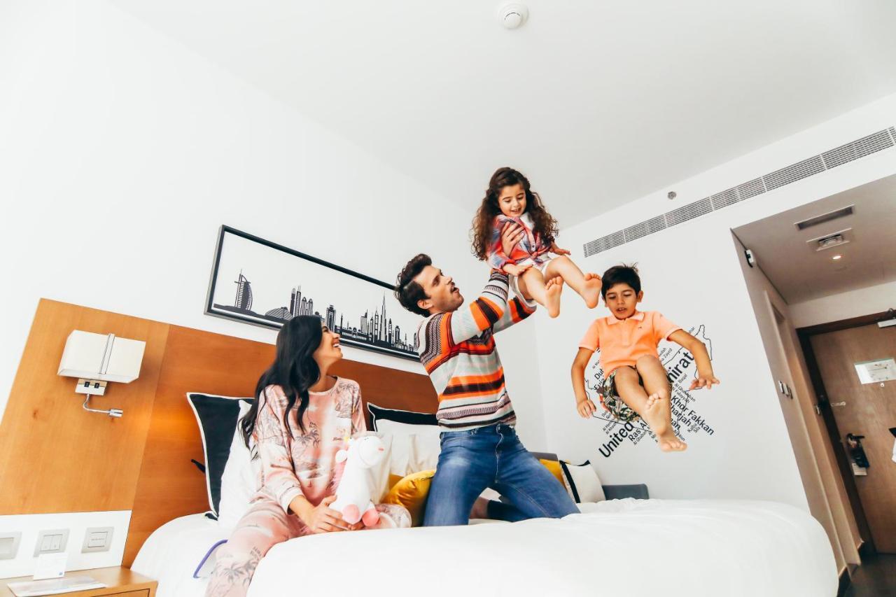 Tryp By Wyndham Dubai Hotel Exterior photo Family in a hotel room